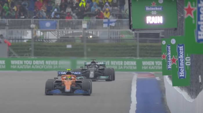 Lewis Hamilton closes on Lando Norris as the rain begins to fall at the Russian Grand Prix.