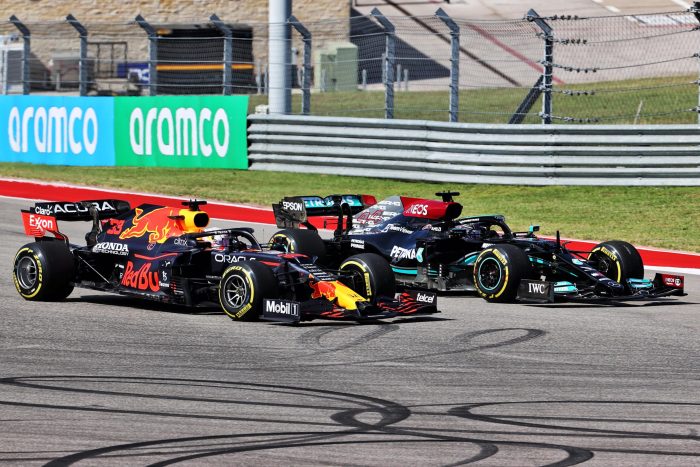 Max Verstappen and Lewis Hamilton battle into the first corner.