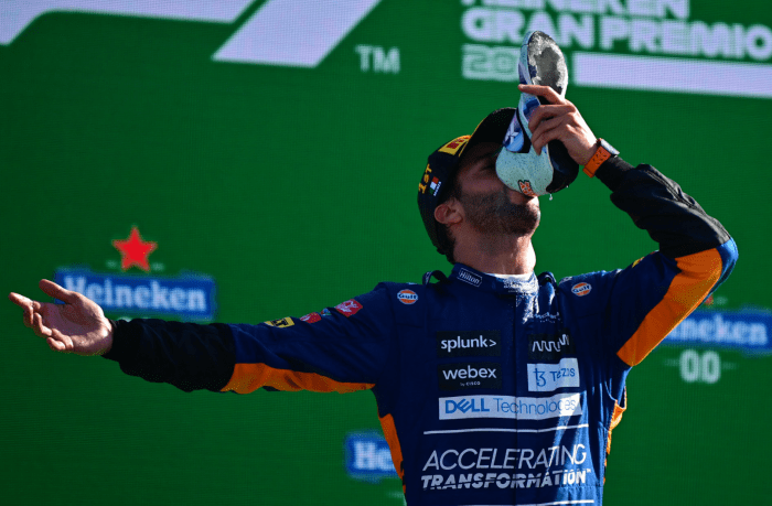 Daniel Ricciardo celebrates winning the Italian Grand Prix with a trademark 'shoey'.