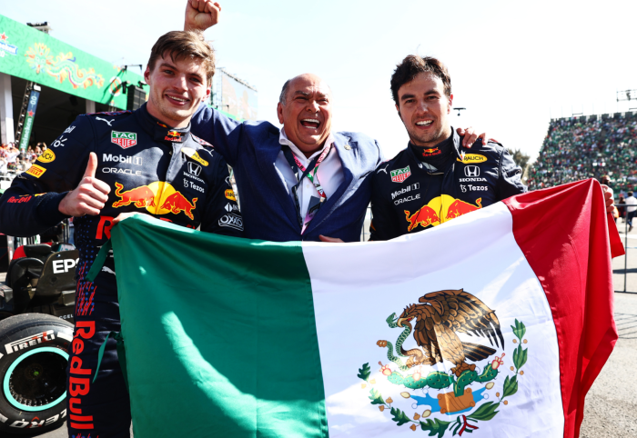 Max Verstappen and Sergio Perez celebrate with the Mexican flag.